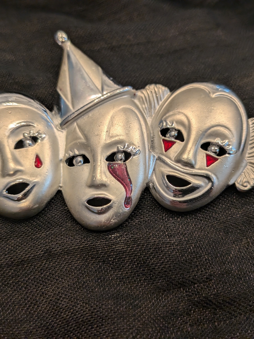 Silver Three-Face Carnival Mask Pin with Red Accent